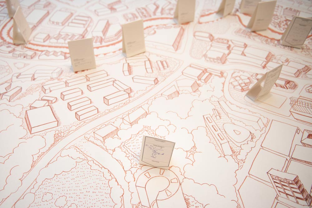 Debbie Ding. 'Here the River Lies.' 2010–2015. Ink on canvas and 1,500 hand-written cards in a specially crafted vitrine. Dimensions variable. Collection of Singapore Art Museum. Image courtesy of Singapore Art Museum.